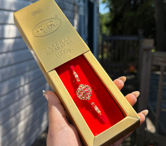 Crystal Rakhi with Gold Packaging