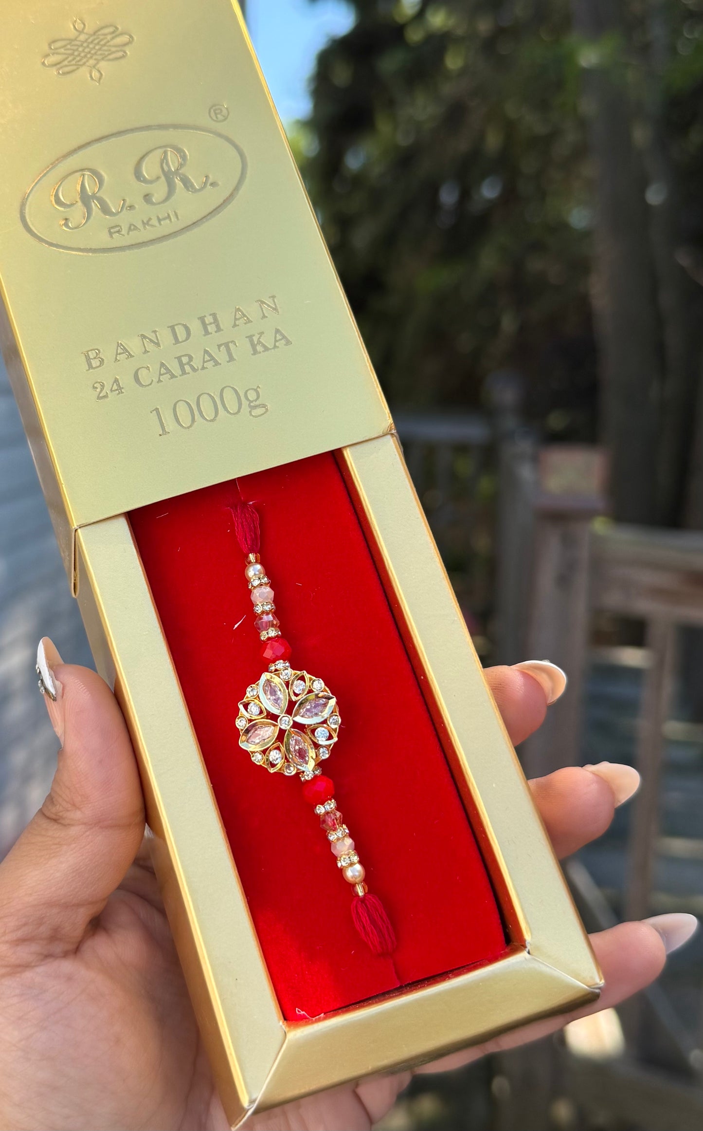 Crystal Rakhi with Gold Packaging
